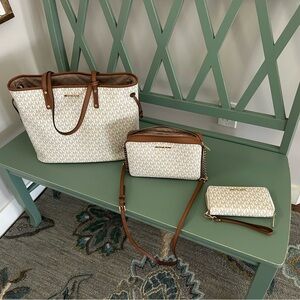 Michael Kors 3 in 1 pocket book with cross body and matching wallet.